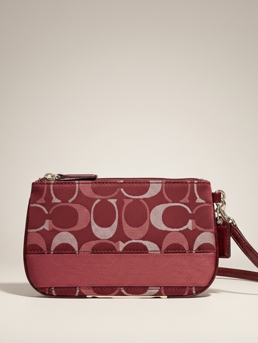Coach Wine Metallic Signature C Striped Wristlet featuring signature “C” EUC